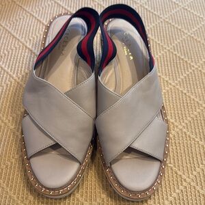 Cecelia New York light beige wedge w blue red strap